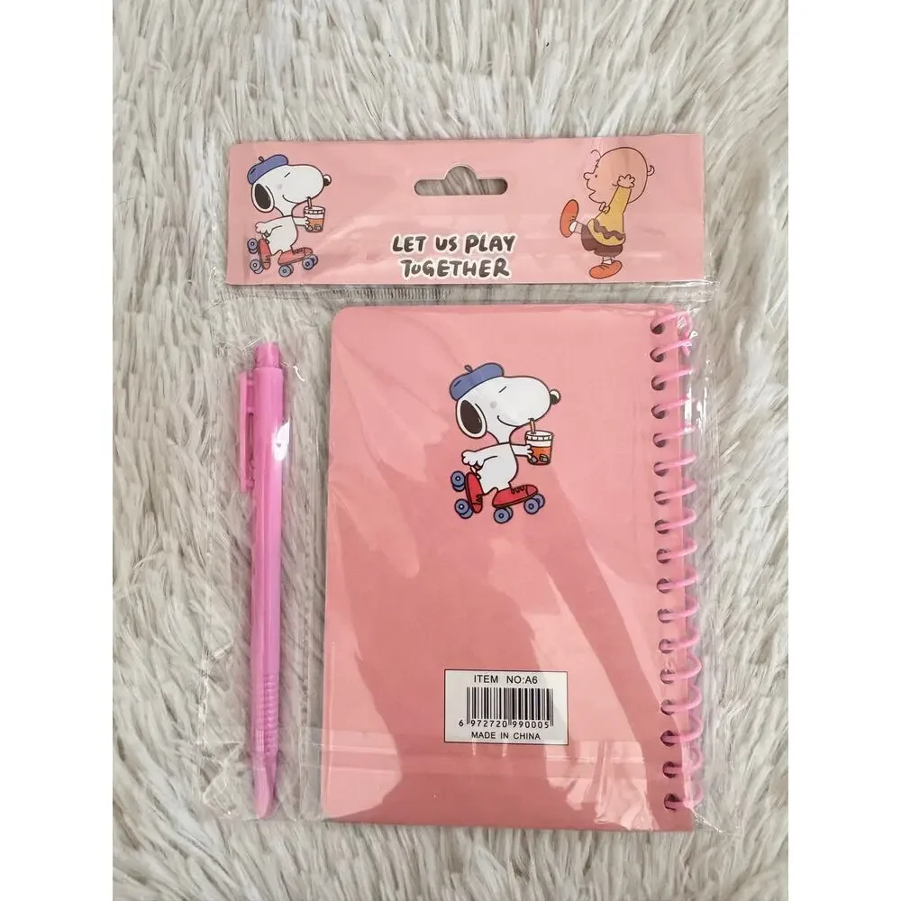 Snoopy spiral pink notebook with pen featuring Snoopy on roller skate size A6 .